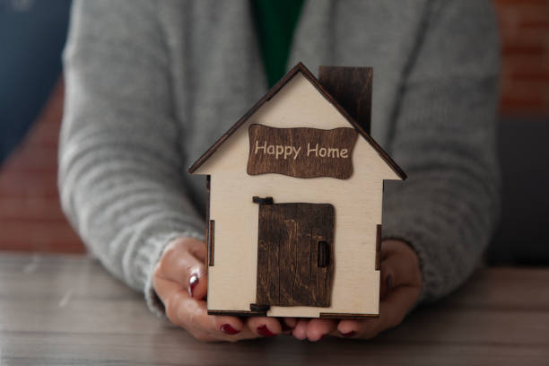 istock woman hand key with house model 1208640018