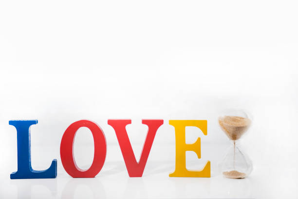 Love colored wooden letters on white background.