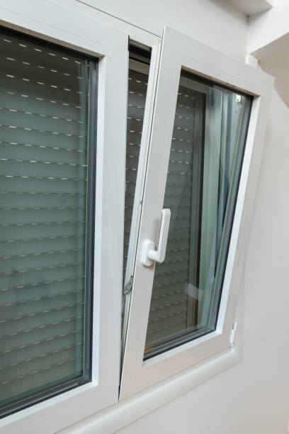 istock Double tilt and turn aluminum thermal break window with vertical fly screen and rolling shutter, casement window with European groove mechanism 1208641300