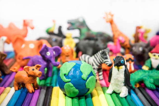 istock Animals made from Play Clay with Earth Planet in middle. 1208641629