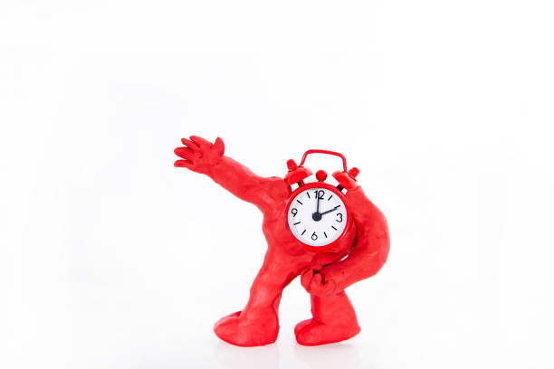 Funny ClockMan made from Play Clay. Isolated on white background.