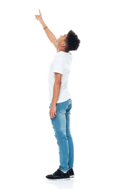 istock Generation z boys standing in front of white background wearing jeans 1208644023