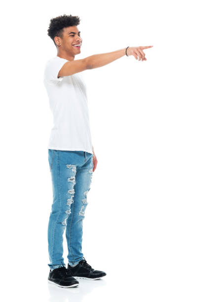 istock Generation z boys standing in front of white background wearing jeans 1208644027
