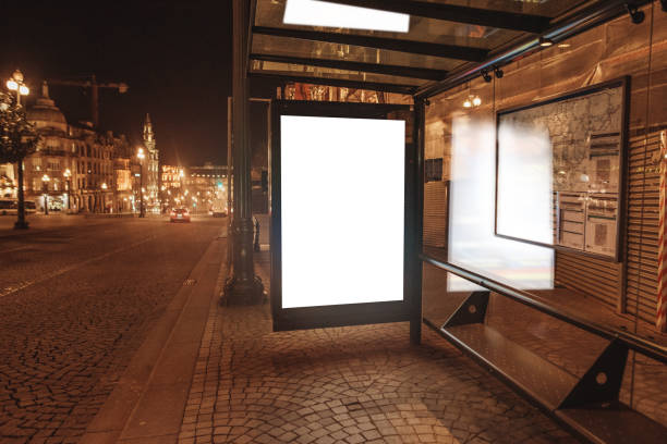istock Bus stop with blank billboard at night 1208646102