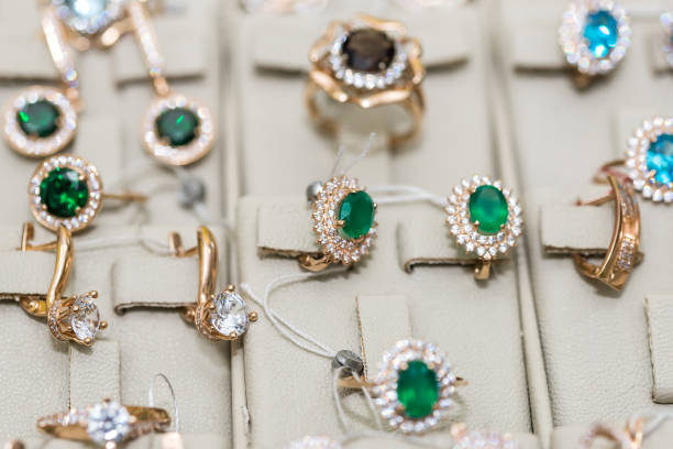 istock Jewellery with gemstones at showcase in store 1208648099