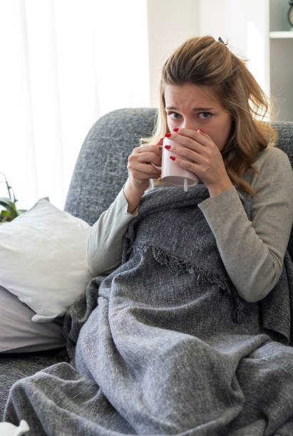 istock Sick woman with flu at home 1208649010