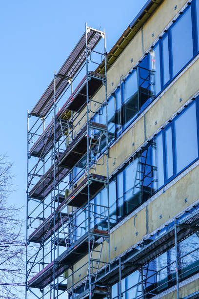 istock house facade renovation and thermal insulation, scaffolding 1208649692