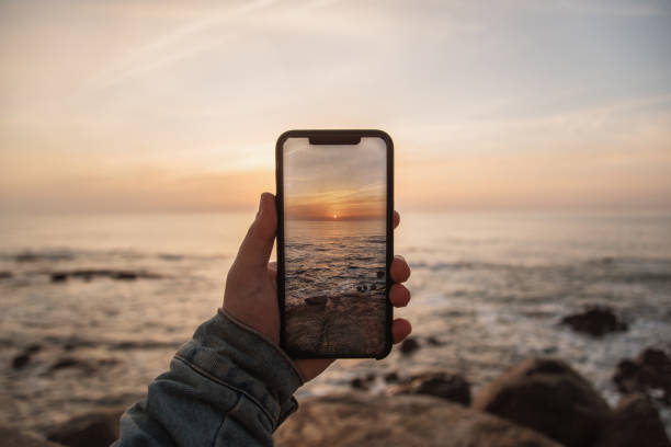 istock Taking a picture of a beautiful sunset sky 1208652504