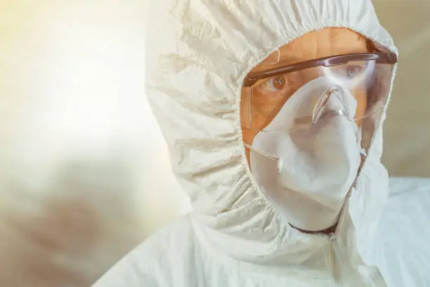 Photo of Perturbed medical worker in protective clothing i