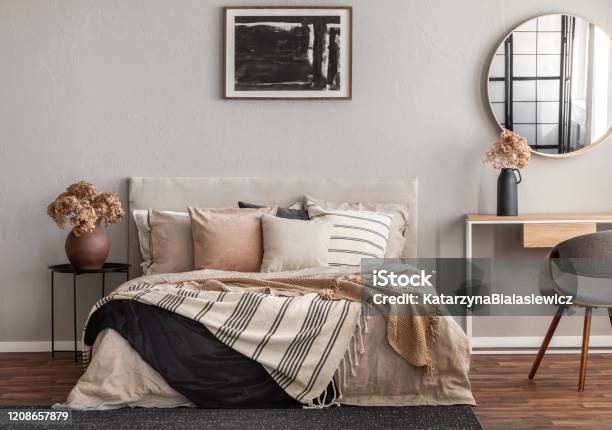 Abstract Black Oil Painting In Frame On Empty Beige Wall Of Cozy Bedroom Stock Photo - Download Image Now