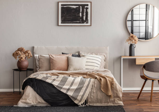 abstract black oil painting in frame on empty beige wall of cozy bedroom - bedding bedroom duvet pillow imagens e fotografias de stock
