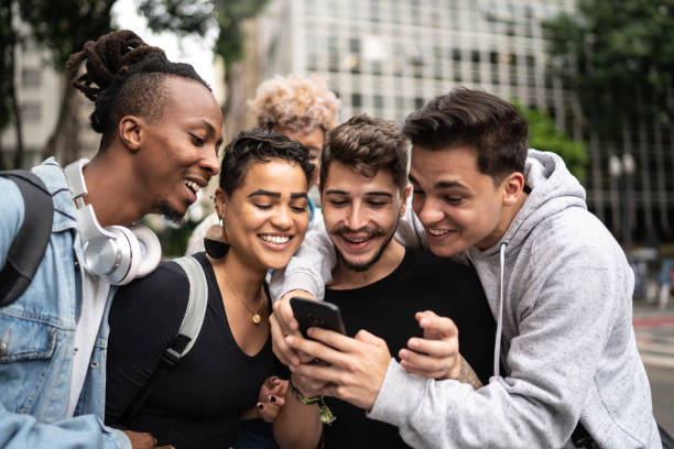 istock Group of friends using smartphone in the city 1208658002