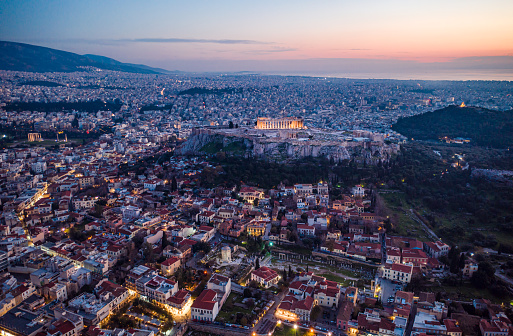 Panoramic iew from the top of Philopappos Hill of the ancient Parthenon, Odeon of Herodes Atticus Theatre and the propylaea gateway on Acropolis Hill at the Greek city of Athens Greece.