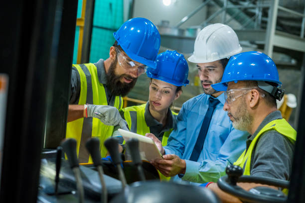 istock Ingeriero man meets with some of his employees to discuss company issues 1208659270