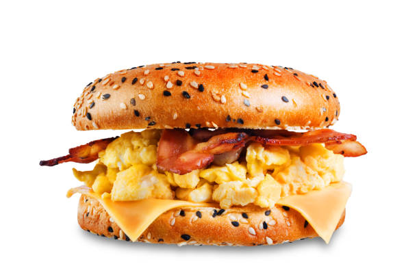 istock Fried bacon cheese egg salad bagel on a white isolated background 1208659779