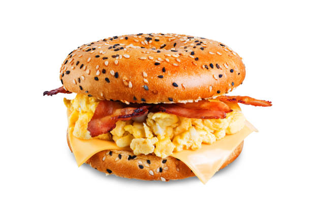 istock Fried bacon cheese egg salad bagel on a white isolated background 1208659782