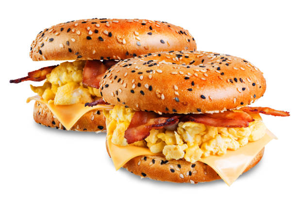 istock Fried bacon cheese egg salad bagel on a white isolated background 1208659810