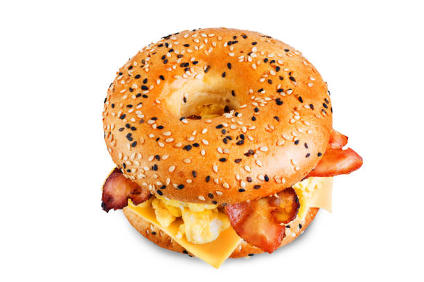 istock Fried bacon cheese egg salad bagel on a white isolated background 1208659842