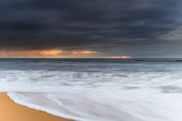 istock Sunrise Seascape and Rain Clouds 1208661169