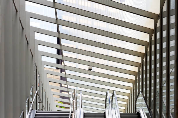 istock Pedestrian bridge with escalator in the city 1208661259