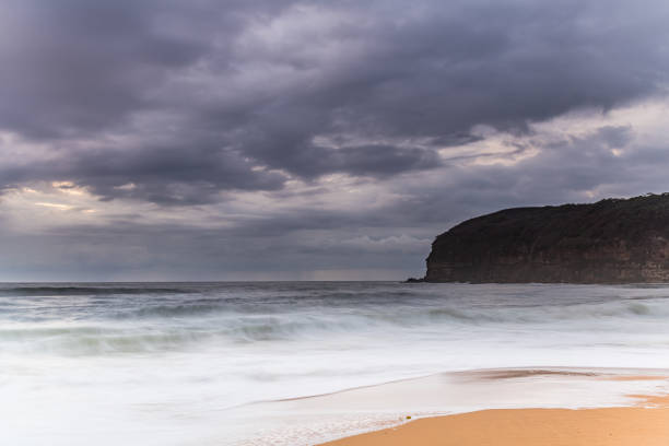 istock Sunrise Seascape and Rain Clouds 1208661279