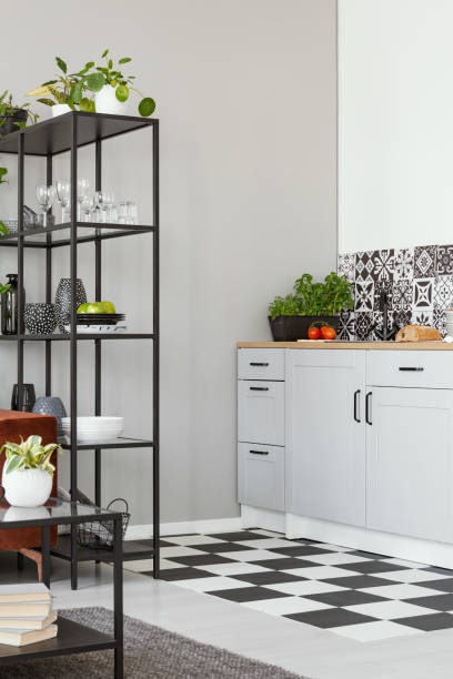 istock Trendy white kitchen interior with elegant wooden cupboards and kitchen accessories 1208662611