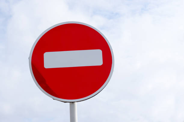 istock no entry road sign on sky background with clouds 1208662698