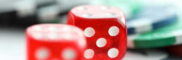 istock Red dices lying with casino chips as gambling symbol 1208663720