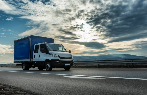 istock Utility transportation van or mini truck driving on a highway 1208666495