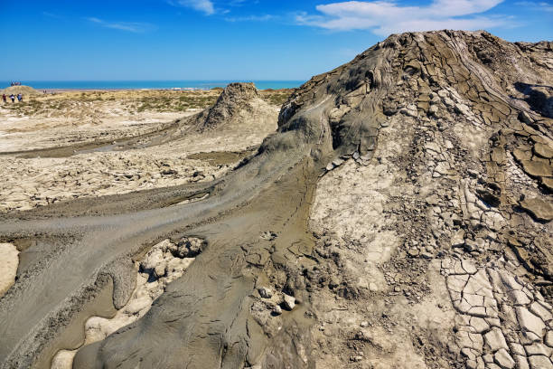 Mud volcano cones in Gobustan near Baku Azerbaijan Mud volcano cone in Gobustan near Baku, Azerbaijan on a sunny day mud volcano stock pictures, royalty-free photos & images