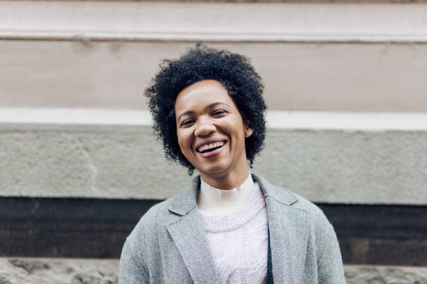 istock Afro girl looking happy 1208668233