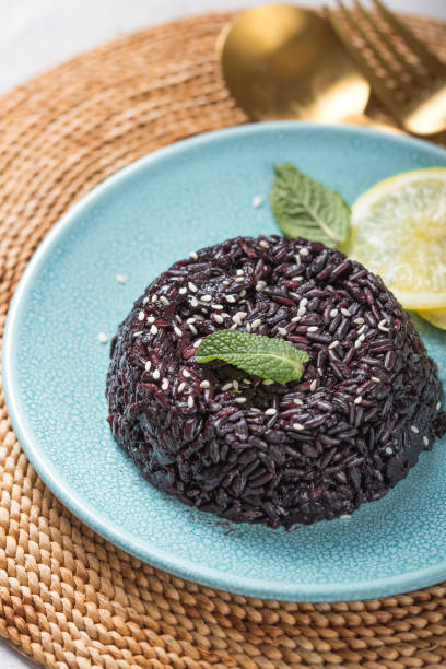 Delicious cooked black rice or risotto. Healthy food concept