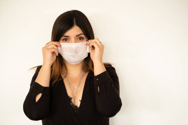 istock young woman with protection mask 1208669286