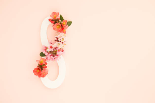 istock March 8 Women's Day greeting card with spring flowers.Soft pink background.Copy space 1208669346