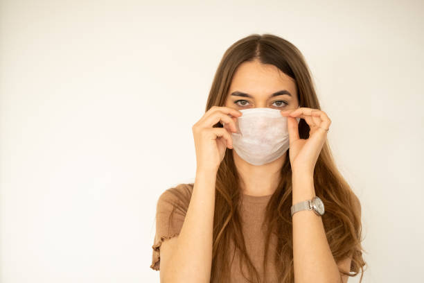 istock young woman with protection mask 1208669956