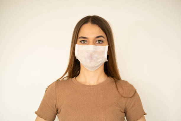 istock young woman with protection mask 1208669999