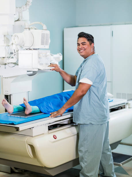 istock Technologist taking x-ray of girl's foot 1208674257