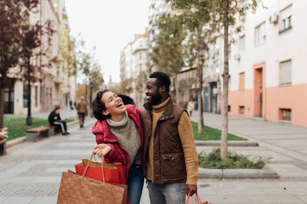 istock Two friends on a shopping spree 1208675401