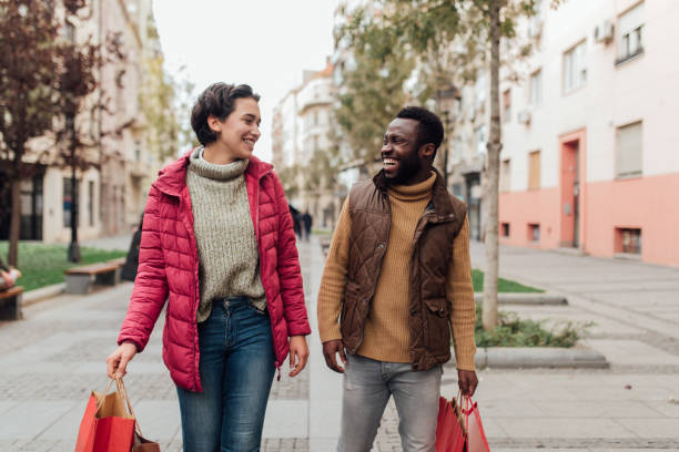 istock Two friends on a shopping spree 1208675412