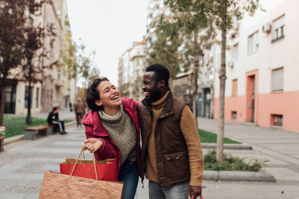 istock Two friends on a shopping spree 1208675414