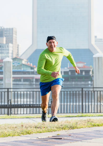 istock Mature man enjoying running in city 1208675731