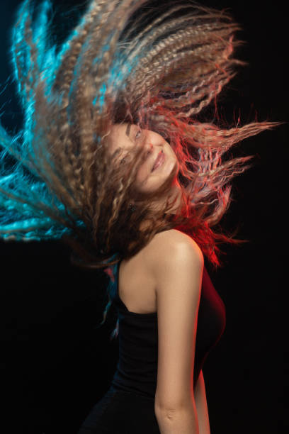 istock woman with flying hair 1208676745
