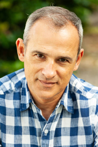 istock Smiling mature hispanic man looking at the camera 1208677505