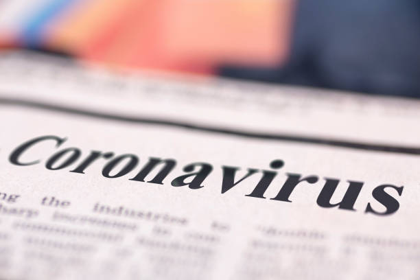 Coronavirus written newspaper Coronavirus written newspaper close up shot to the text. middle east respiratory syndrome stock pictures, royalty-free photos & images