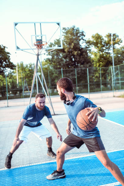 istock Friends Having Their Weekend Basketball Match 1208681109