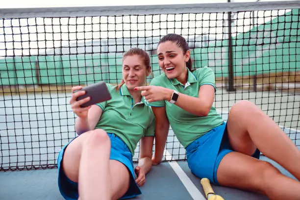 Cute Female Tennis Players Watching Funny Videos