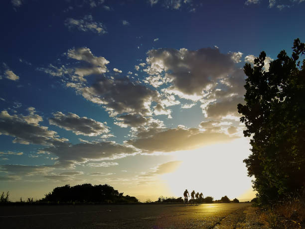 Cycle early morning sunrise ride with blue sky and beautiful clouds