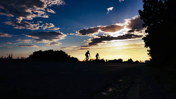 istock Cycle early morning sunrise ride with blue sky 1208686411