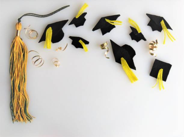 istock Graduation caps throw in air, tassel border, copy space 1208690705