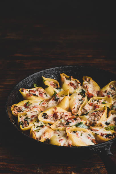 istock Skillet of stuffed jumbo shells pasta 1208693576